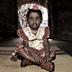 India girl in mud hut